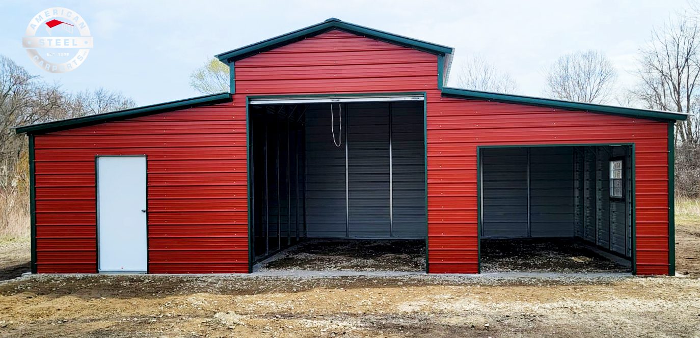 Classic red steel barn with black roof and dual lean-tos