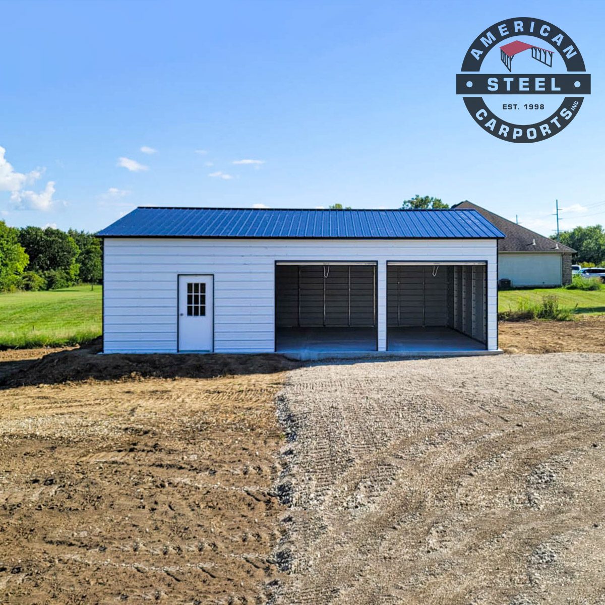 White steel garage with blue vertical roof and walk-in door