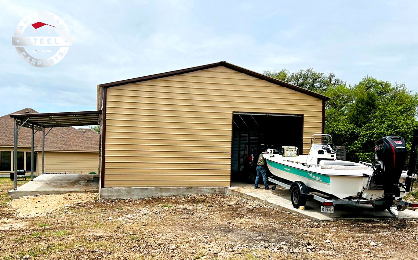 Tan steel garage used for boat storage with wide roll-up bay