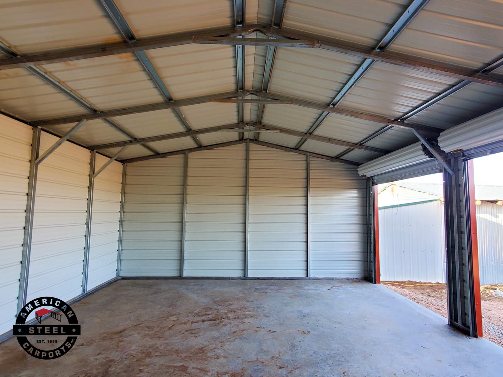 Interior view of steel carport with attached enclosed section